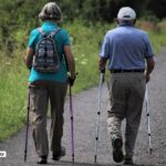 alt="old couple walking"