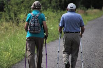 alt="old couple walking"