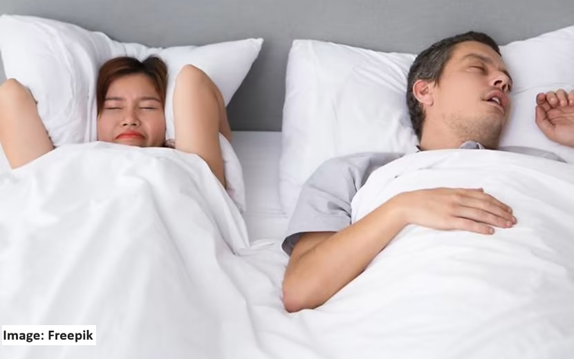 alt="snoring man"