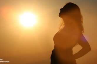 alt="woman in bright sun"