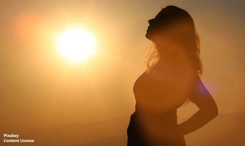 alt="woman in bright sun"