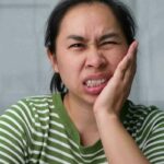 alt="Poor oral health and migraines"